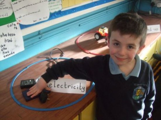 child with electricity toy