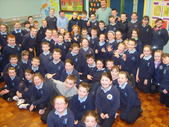 Photograph of Tom with pupils