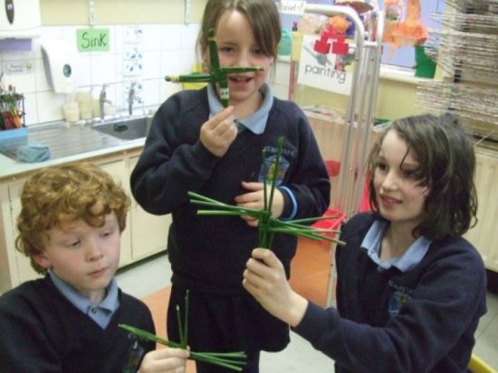 3 children making cross